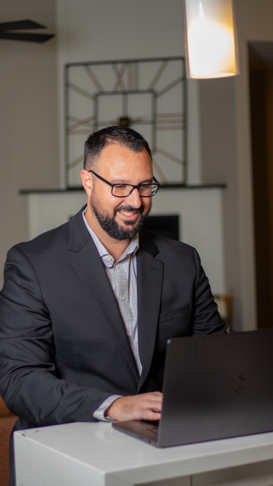 Adam Diaz reviewing business numbers on a laptop